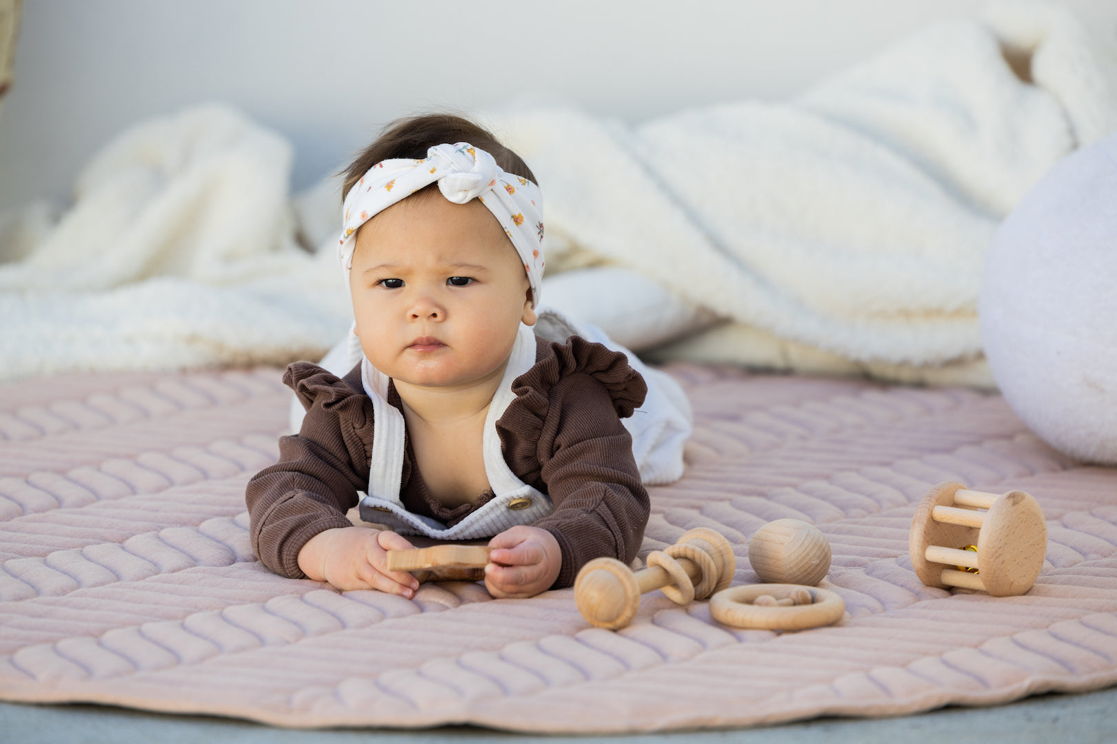 baby on The Kairos Child's Pampas play mat during tummy time session